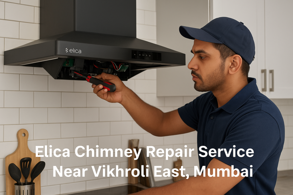 Professional technician repairing an Elica chimney in a modern kitchen in Vikhroli East, Mumbai.